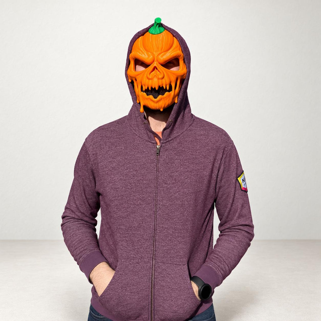 Adult wearing the pumpkin skull mask under a hood, front view